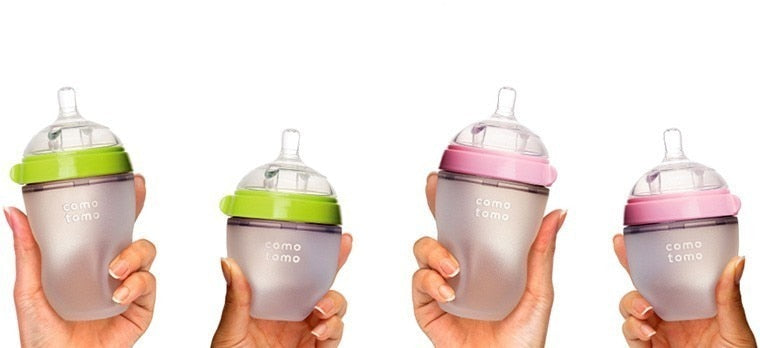 Two pack pink and green comotomo baby bottles small and large.
