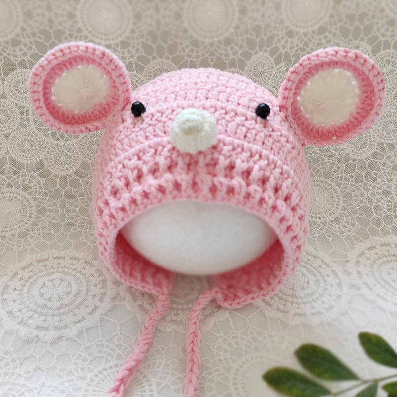 Pink and white newborn crochet knitted mouse bonnet with eyes and a nose for photography and reborn dolls.