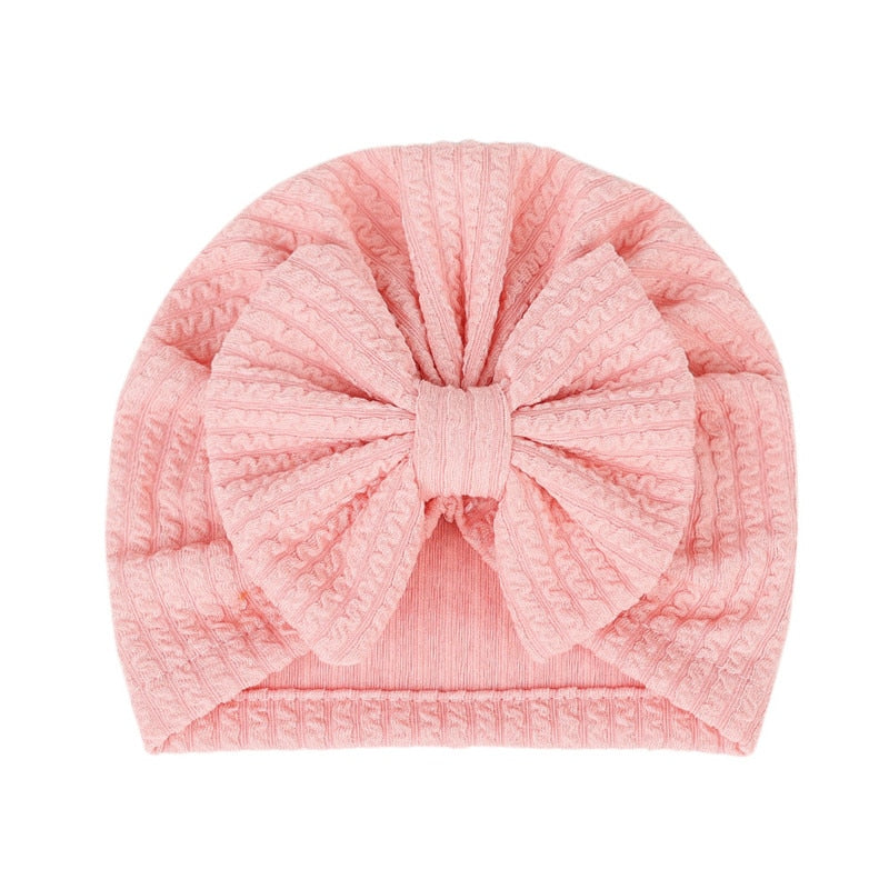 Pink Waffle Knit Baby Turbans with Large Bows for Newborns and Reborn Dolls.