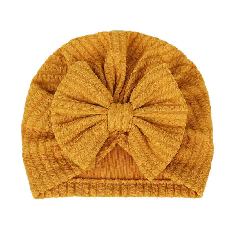 Mustard Yellow Waffle Knit Baby Turbans with Large Bows for Newborns and Reborn Dolls.