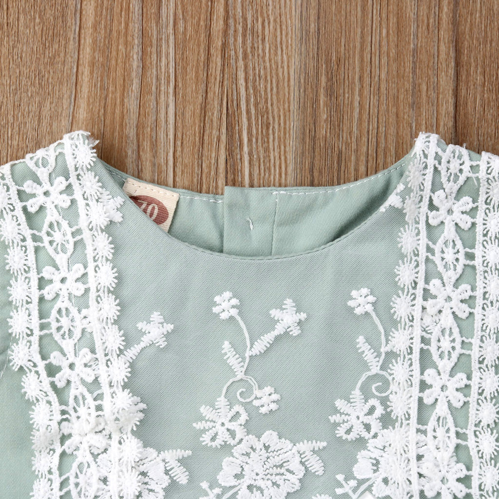 Close-up of neckline on the mint green Spanish baby clothing bubble romper for reborns and babies: reborn doll clothing