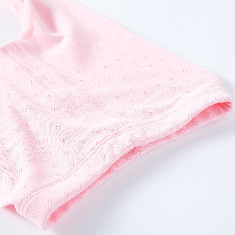 Pink newborn baby girl eyelet leotards with feeties in white, pink, baby blue and yellow for reborn dolls.