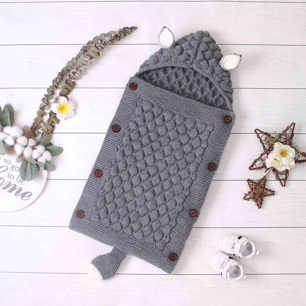 Grey Sleepy Little Fox Knitted Sleep Sacks for newborns, babies and reborn dolls. Envelope style sleeping bag with buttons, fox ears, and a fox tail.