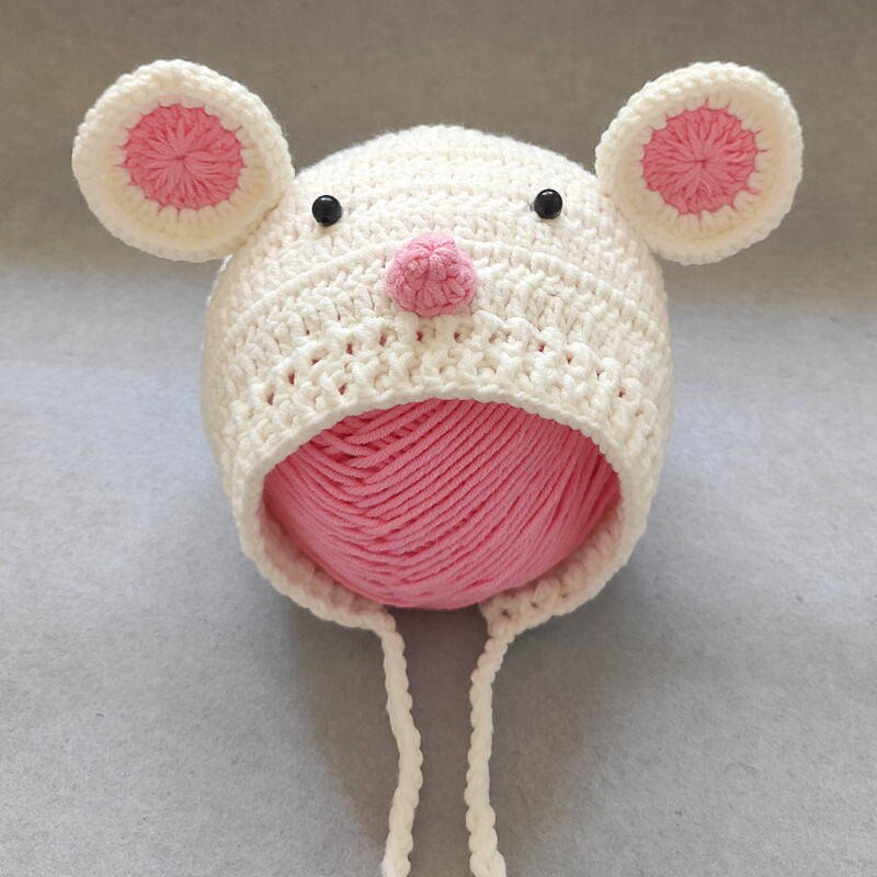 White and pink newborn crochet knitted mouse bonnet with eyes and a nose for photography and reborn dolls.