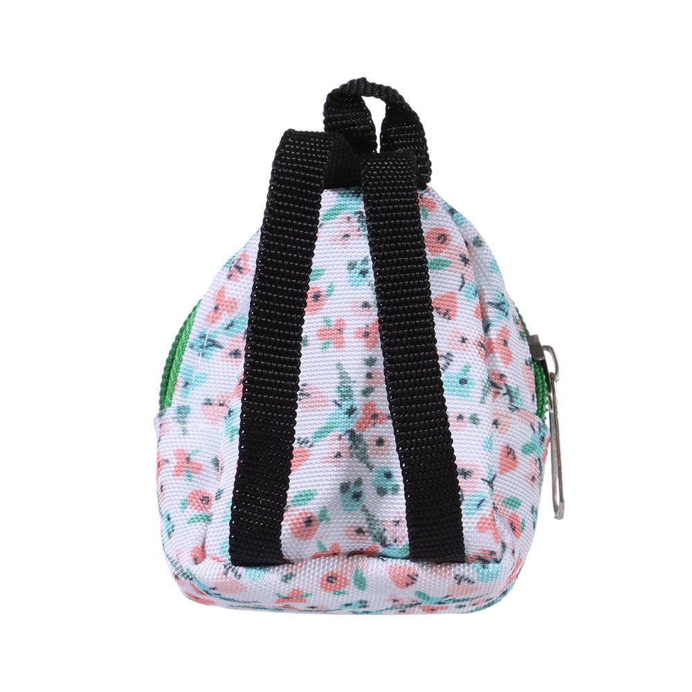 Back of the green and floral miniature backpack with black straps, front zipper and main zipper for mini reborn silicone piglets, pandas, hamsters, Blythe dolls, barbies, BJD dolls and other small dolls.