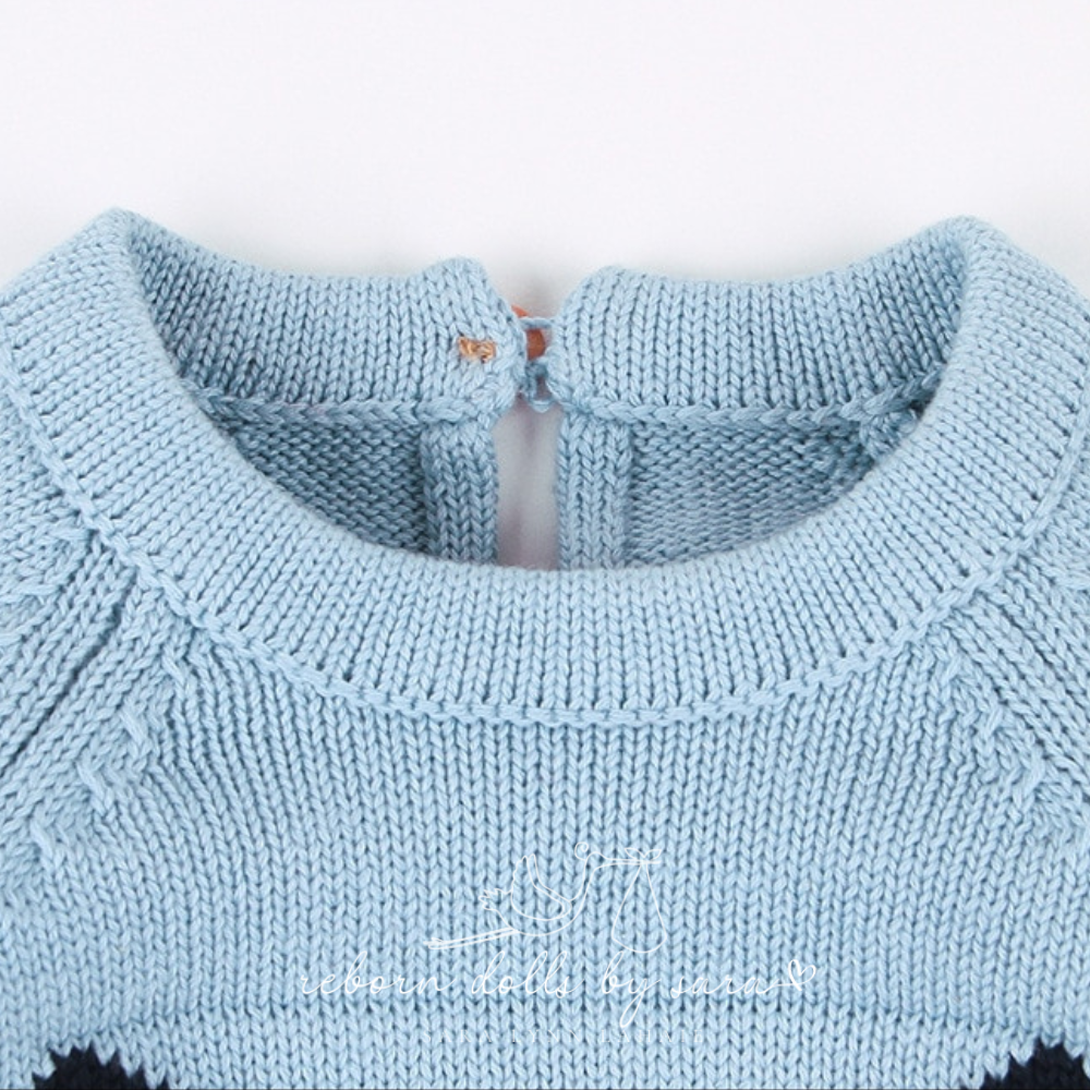 Close-up of the neckline and collar area of a blue knitted long-sleeve sweater onesie romper for reborn baby dolls.