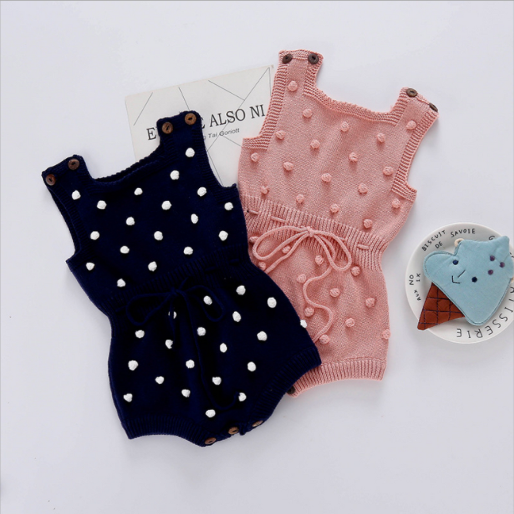 Baby pink and navy blue sleeveless knitted bubble rompers with pompoms for baby girls and reborn dolls.