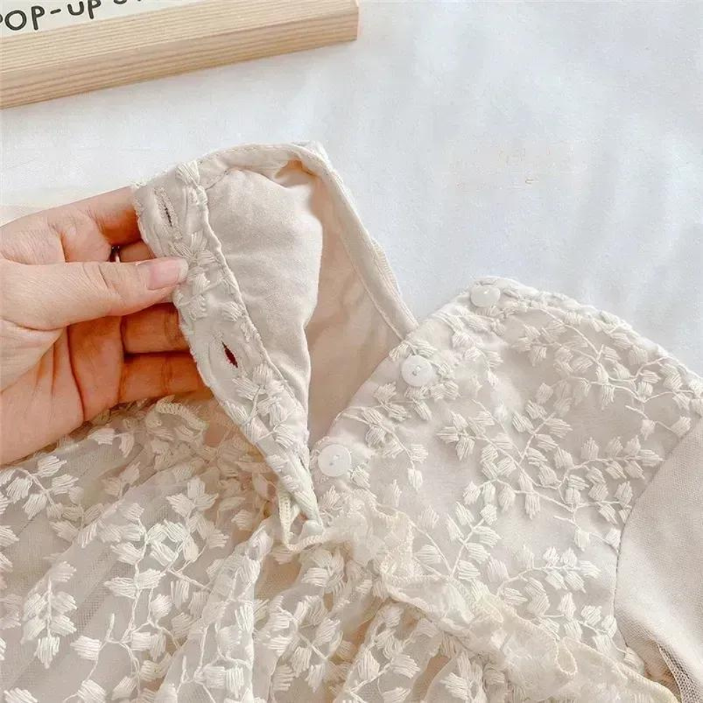 Long-sleeve elegant lace dress with vine embroidery for reborn baby dolls.