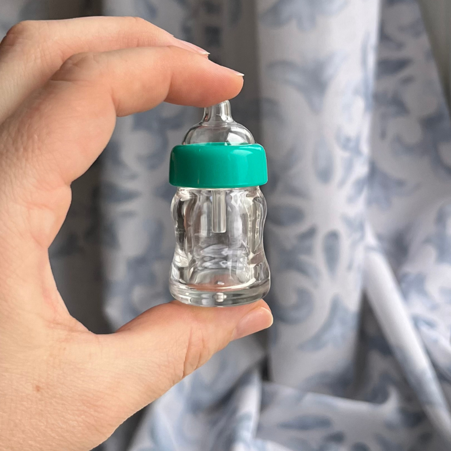 Miniature baby bottles for mini silicone pets, micro pigs, and small baby dolls.