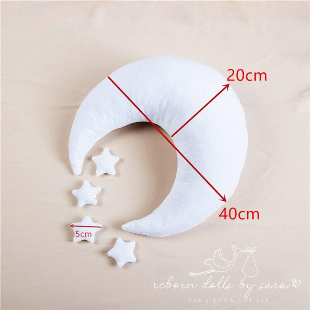 Size details of a white flannel moon crescent photography pillow and four star pillows for newborn and reborn doll photography.