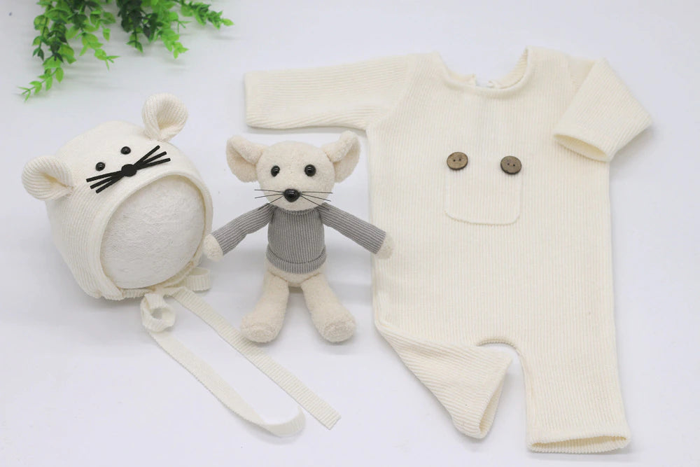 White ribbed cotton long-sleeve photography romper for newborn and preemie sized babies and reborn dolls with a mouse bonnet and mouse stuffie.