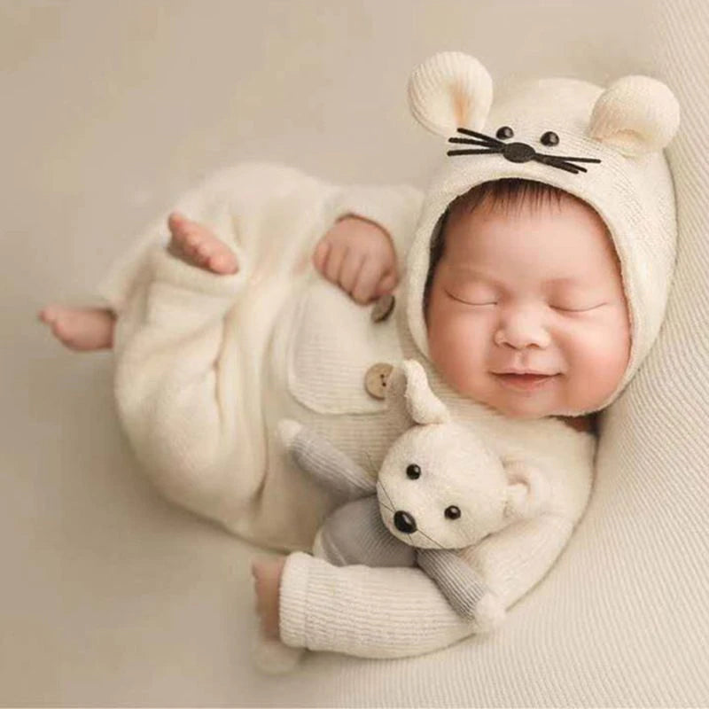 Newborn baby boy wearing a white preemie and newborn sized three piece photography outfit with mouse bonnet and mouse stuffie for reborn baby dolls.