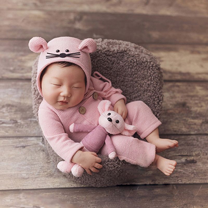 Newborn baby girl wearing a pink preemie and newborn sized three piece photography outfit with mouse bonnet and mouse stuffie for reborn baby dolls.