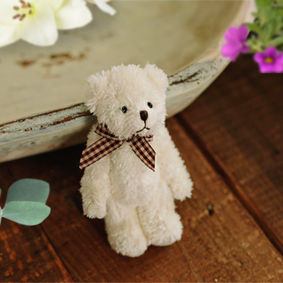 Plain white teddy bear with plaid bow. Reborn baby doll teddy bear toys that can be used by newborn photographers as well as newborn photography props.