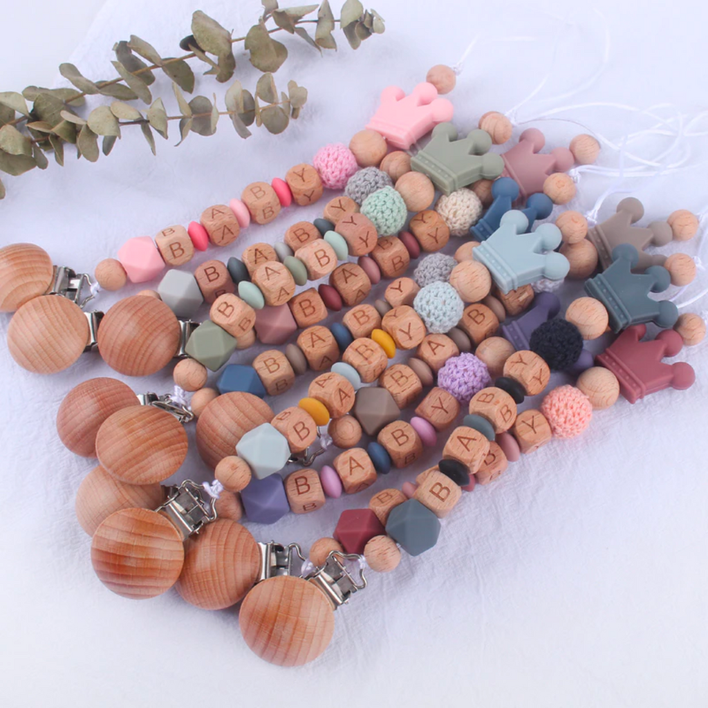 Personalized silicone pacifier clips with wooden fastener, crown bead, crochet beads, wooden beads and silicone beads in every color with baby's name for reborn baby dolls.