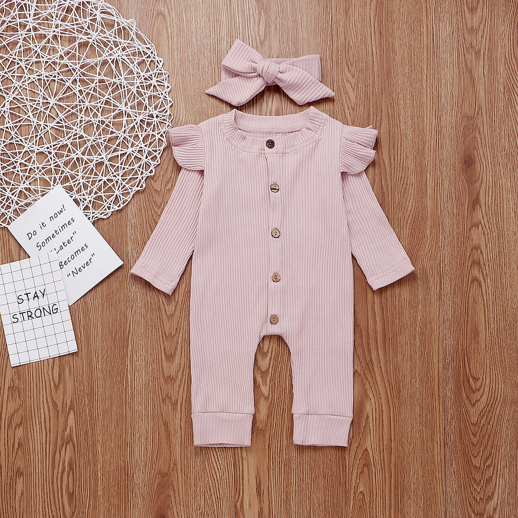 Light baby pink boho ribbed long-sleeve jumpsuit romper with buttons, frilly shoulder sleeves and a matching headband for reborn doll clothing and baby girls.