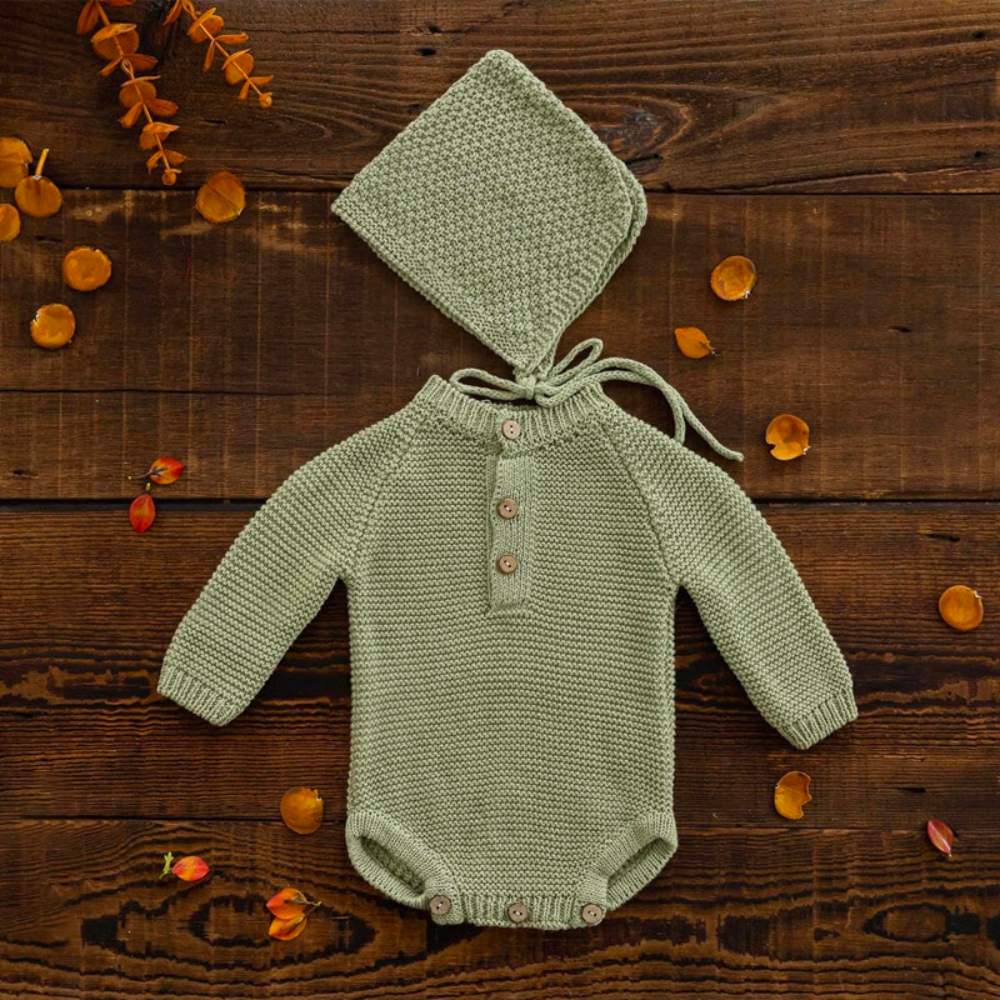 Sage green long-sleeve crochet knitted baby onesie with matching pixie bonnet for reborn baby dolls and newborn photographers.