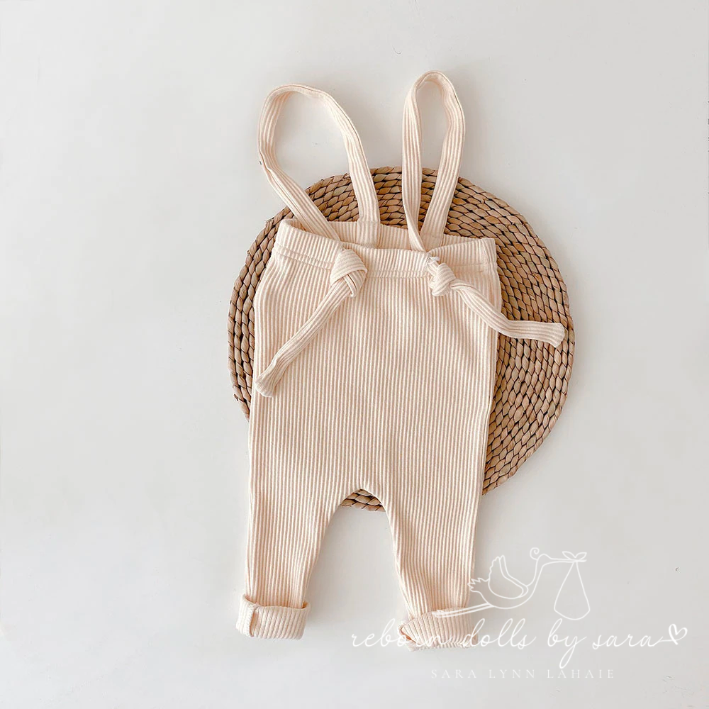 Off-white cream coloured boho baby bohemian ribbed adjustable reborn doll overalls for reborns and babies. Cake smash outfit. Baby shower gift. Newborn baby clothes. Expecting mom gift. Expectant mom gift. Reborn doll clothes. Reborn clothing.