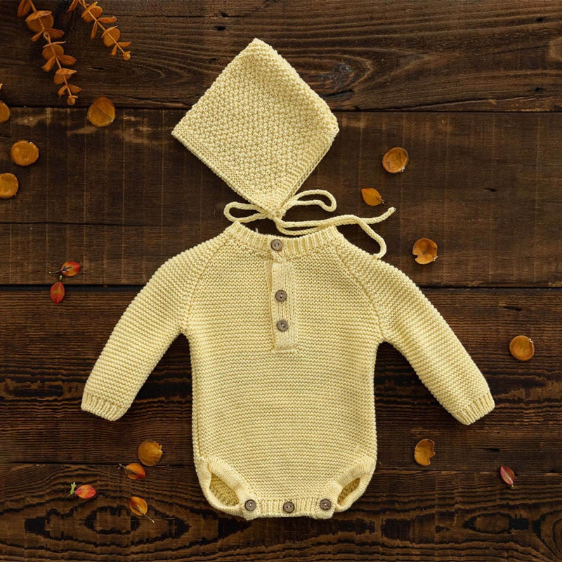 Light yellow long-sleeve crochet knitted baby onesie with matching pixie bonnet for reborn baby dolls and newborn photographers.