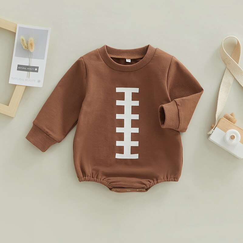 Longsleeve football baby bubble romper with a crewneck for baby boys and reborn dolls. Brown with a white stitch down the centre.