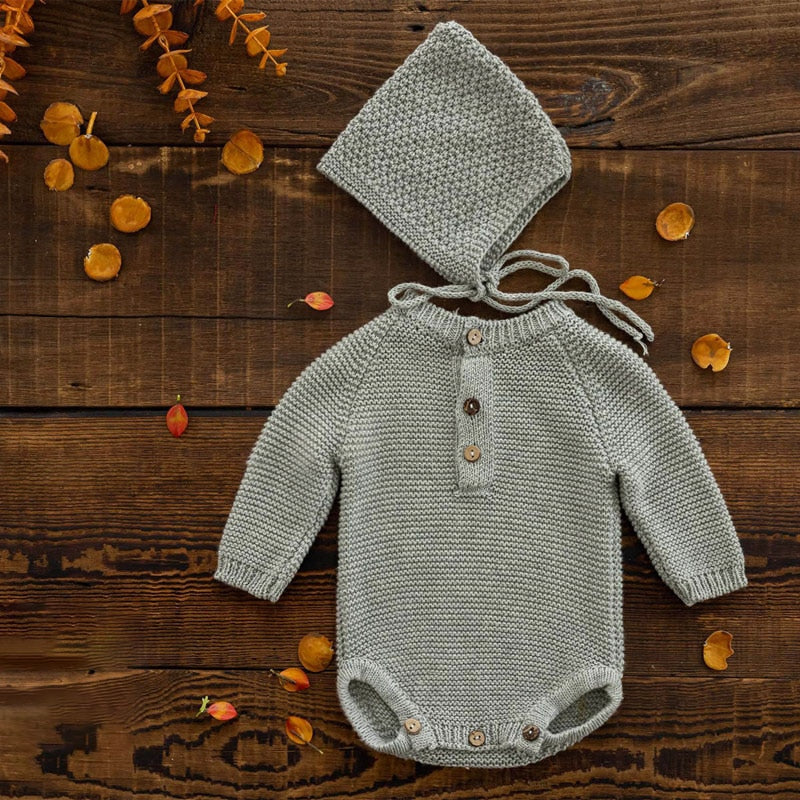 Grey long-sleeve crochet knitted baby onesie with matching pixie bonnet for reborn baby dolls and newborn photographers.