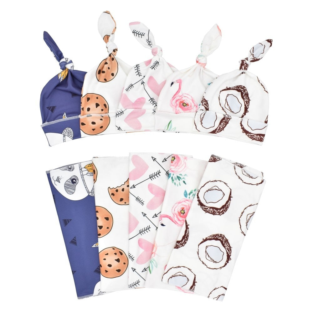 Four newborn sized swaddle cocoon sleep sacks with matching hats for reborn baby dolls.