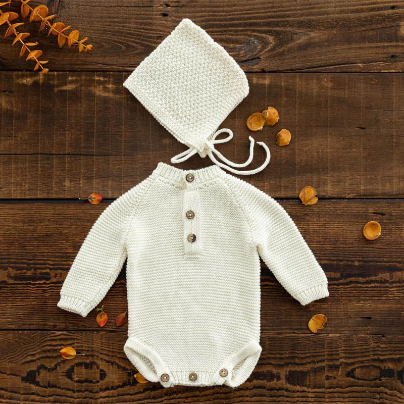 Ivory white long-sleeve crochet knitted baby onesie with matching pixie bonnet for reborn baby dolls and newborn photographers.