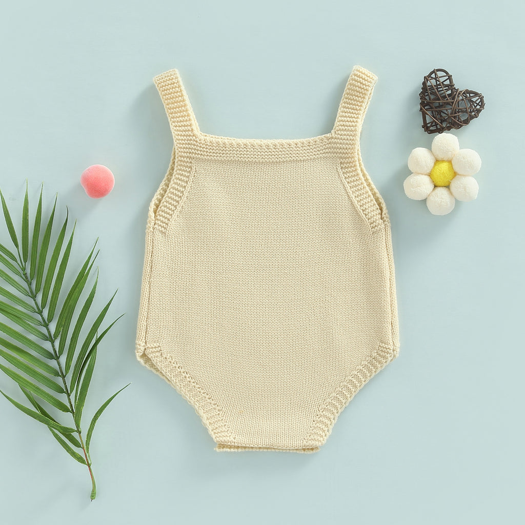Back of Beige knitted overall onesie with button straps and button up crotch for reborn baby boys or girls.