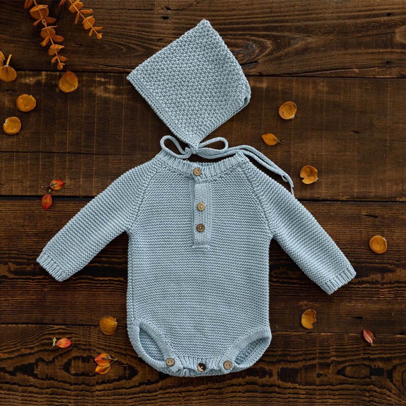 Light blue long-sleeve crochet knitted baby onesie with matching pixie bonnet for reborn baby dolls and newborn photographers.