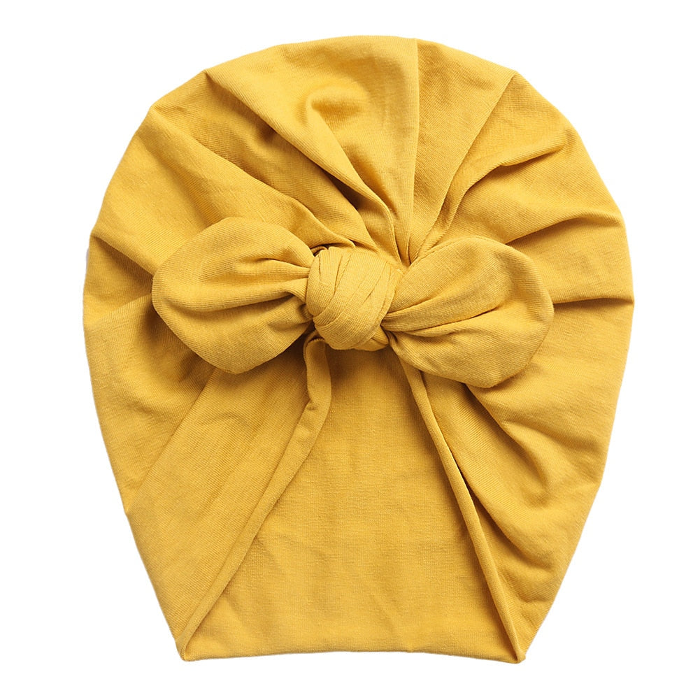 Mustard yellow boho butterfly turban head wrap for newborn babies and reborn dolls.