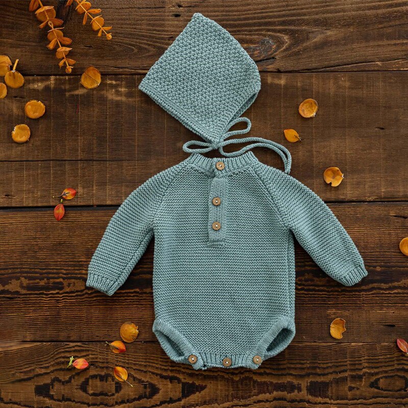 Ocean dark blue long-sleeve crochet knitted baby onesie with matching pixie bonnet for reborn baby dolls and newborn photographers.