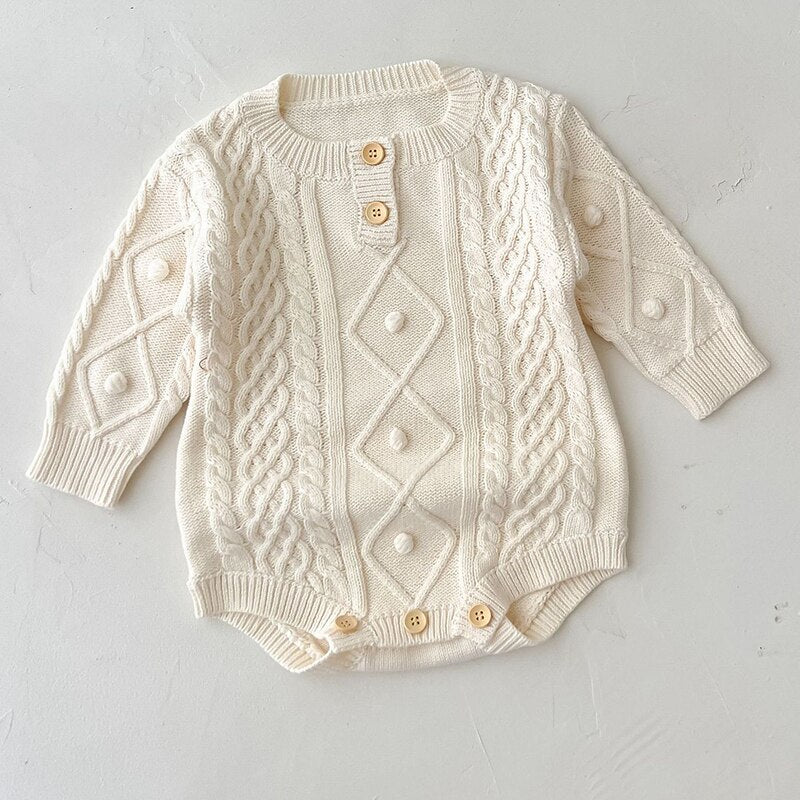 Off-white oatmeal coloured long-sleeve single-breasted knitted onesie for babies and reborn dolls. Unisex.