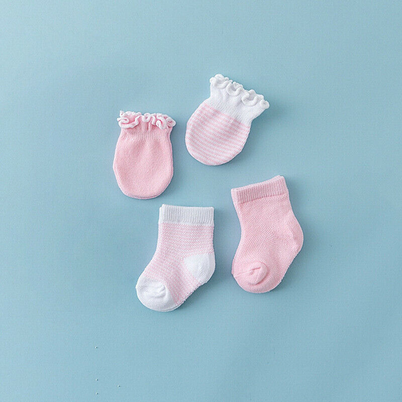 Pink set of anti-scratch mittens in solid and stripes, and two pairs of socks, one solid pink and one pink and white striped with white toe and white ankle. Fits preemies, newborns, reborns, dolls and babies.