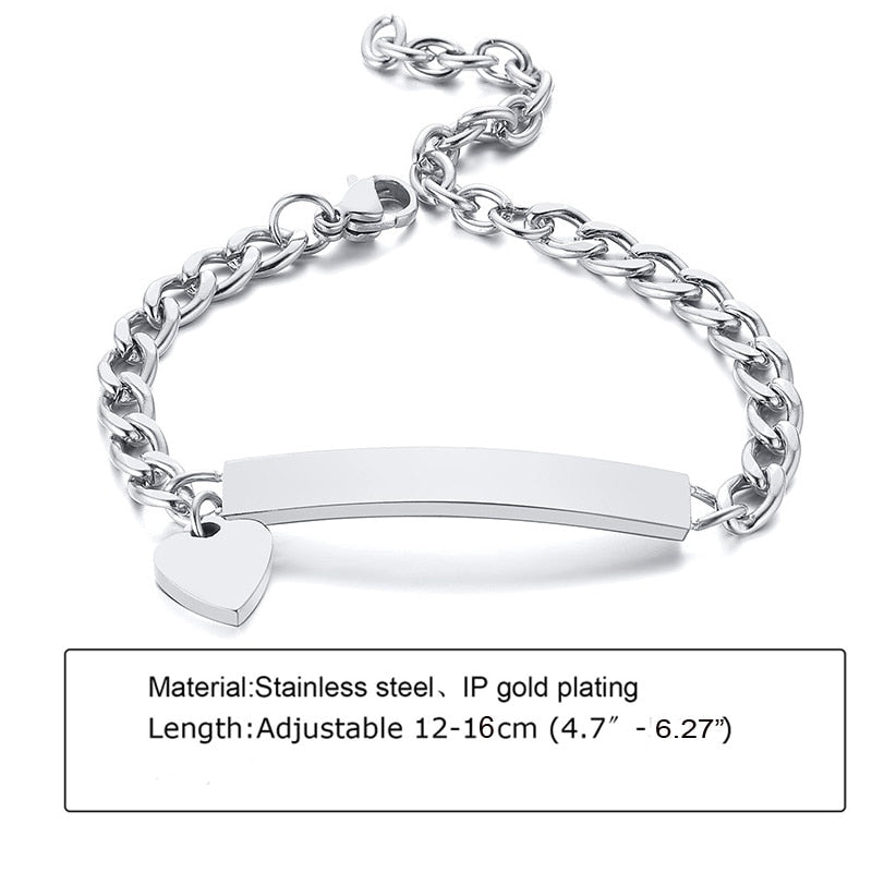 Personalized baby bracelet in silver plated stainless steel for reborn dolls with a plate for engraving and a heart charm.