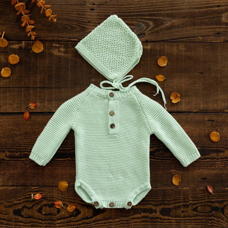 Mint green long-sleeve crochet knitted baby onesie with matching pixie bonnet for reborn baby dolls and newborn photographers.