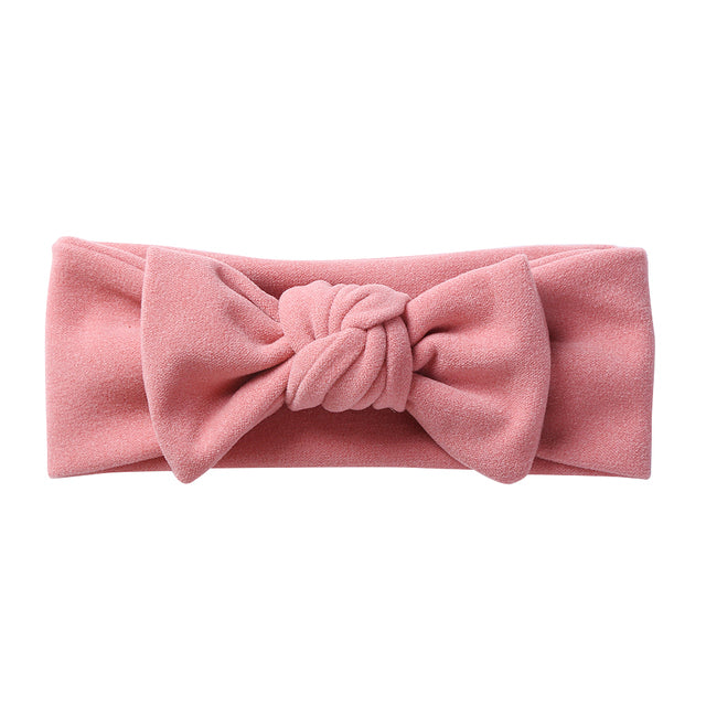 Pink solid color faux cashmere baby headband for girls and reborn dolls.