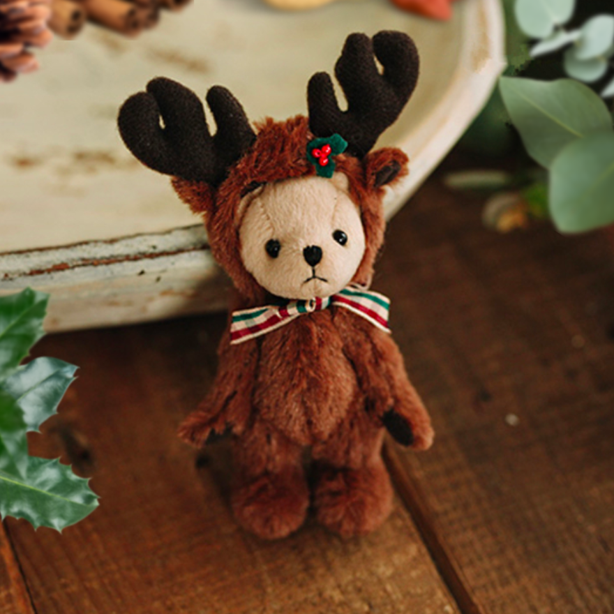 Teddy bear wearing a reindeer costume.  Reborn baby doll teddy bear toys that can be used by newborn photographers as well as newborn photography props.