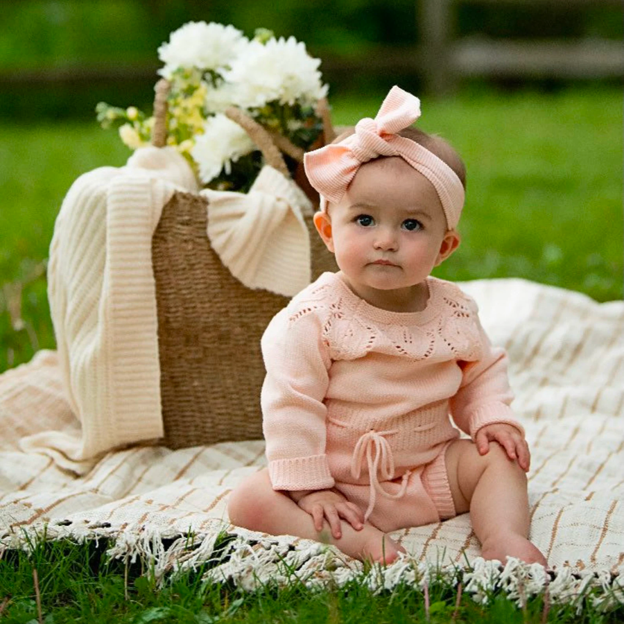 Reborn dolls for sale. Pink and white knitted spanish vintage baby clothing for reborn dolls.