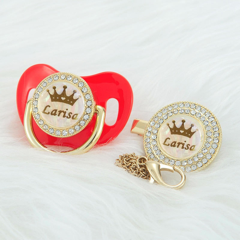 Red Prince and Princess Custom Pacifiers with baby's name and gold chain with rhinestone Pacifier Clips for reborn dolls and newborn babies.