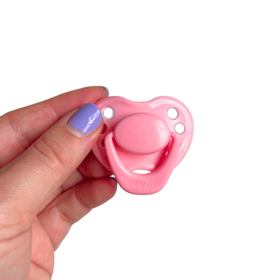 Pink Pink Magnetized Pacifier for Reborn Baby Dolls. Newborn sized pacifier with magnet for reborns. Reborn doll magnetic pacifiers. Pacifier with magnet for reborn dolls. Reborn doll pacifiers by HoneyBug. Reborn dolls.