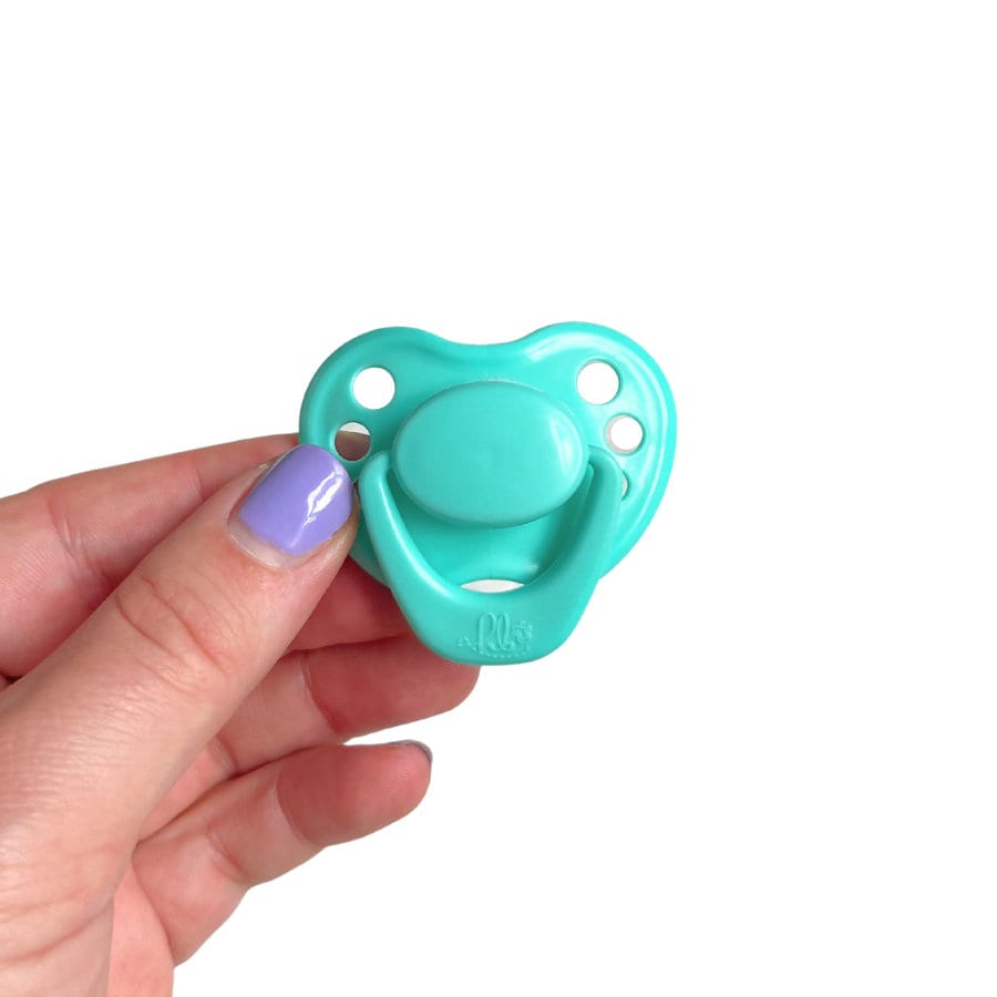 Turquoise aqua blue green Pink Magnetized Pacifier for Reborn Baby Dolls. Newborn sized pacifier with magnet for reborns. Reborn doll magnetic pacifiers. Pacifier with magnet for reborn dolls. Reborn doll pacifiers by HoneyBug. Reborn dolls.