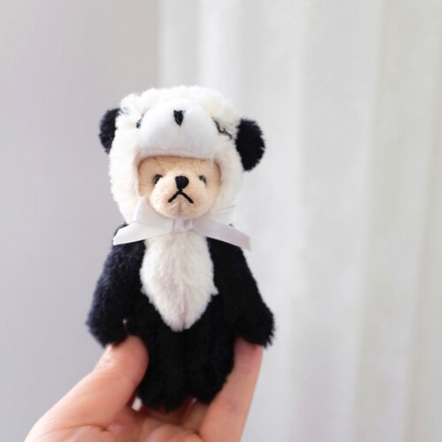 Teddy bear wearing a panda bear costume. Reborn baby doll teddy bear toys that can be used by newborn photographers as well as newborn photography props.