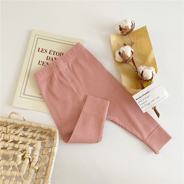 Pink gender neutral unisex solid color ribbed leggings pants for reborn dolls, cuddle babies, boys, girls, and reborns.