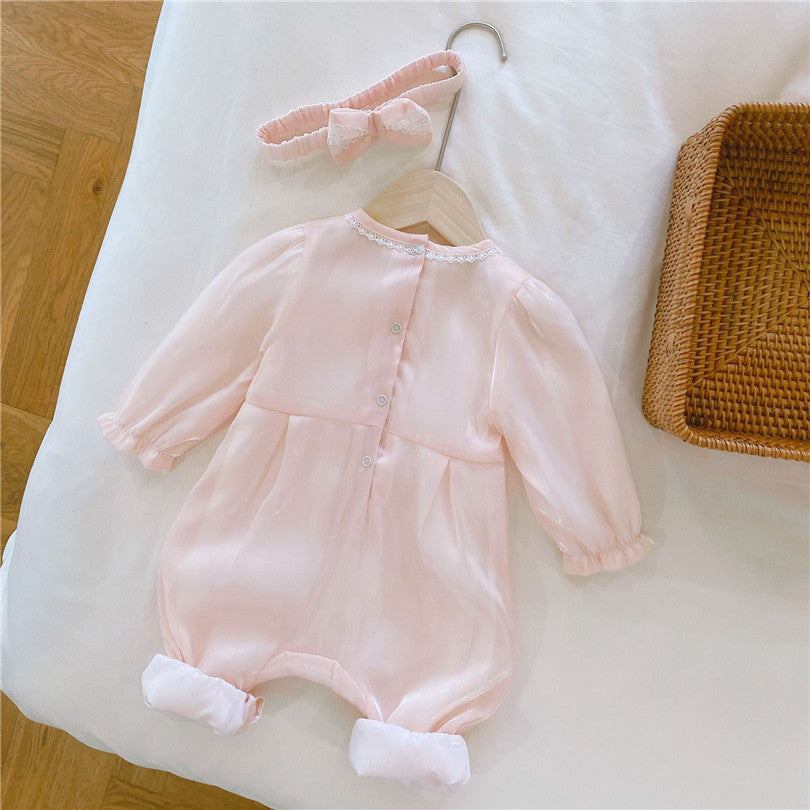 Back of Pink long-sleeve Spanish baby romper with lace embroidery, silk bows, and matching headbands for reborn dolls.