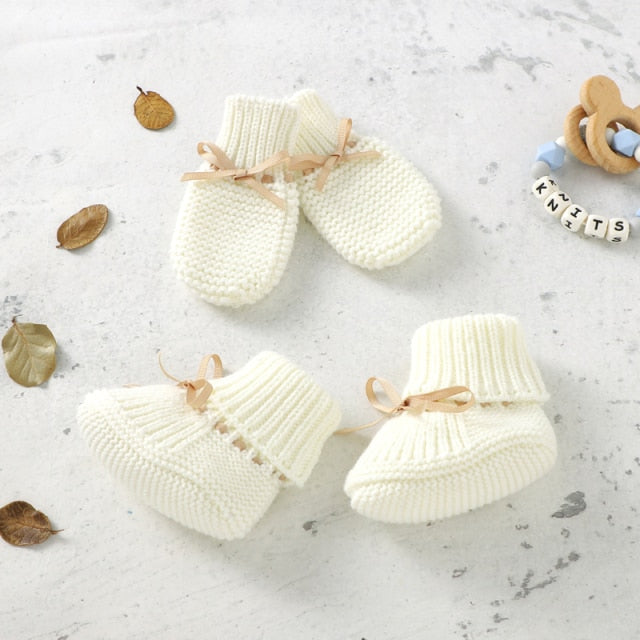 Ivory white crochet knit booties and anti-scratch mitts for reborn dolls with leather drawstring.