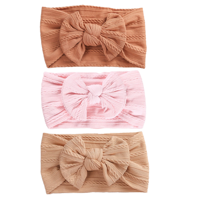 Pumpkin Pink and Beige cable knit headband with bow for baby girls, reborns, cuddle babies and newborns.