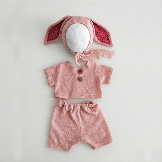 Pink knitted three piece bunny rabbit wool bonnet photography outfit for reborn dolls, cuddle babies and newborns.