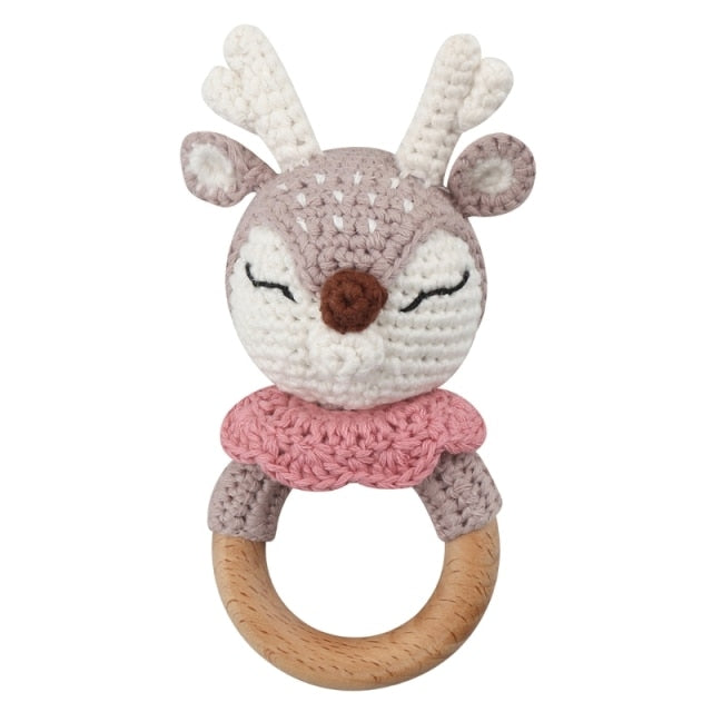 pink crochet deer rattle with wooden teether for reborns, cuddle babies, and newborns photography prop.