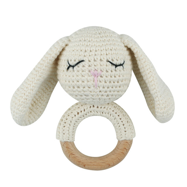 White crochet bunny rattle with wooden teething ring for reborn dolls cuddle babies or newborn babies.