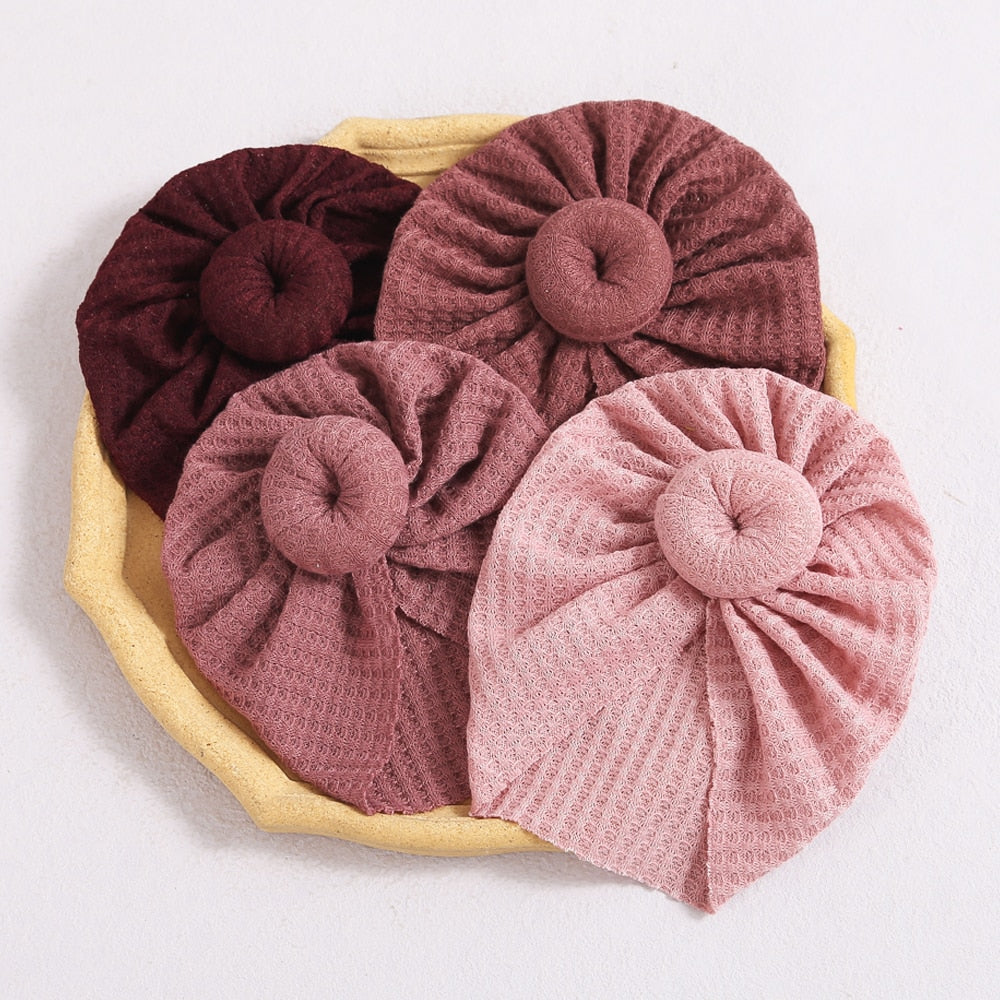 Burgundy, blush pink, rose pink and baby pink turban wraps aka donut hats for reborn baby girls.